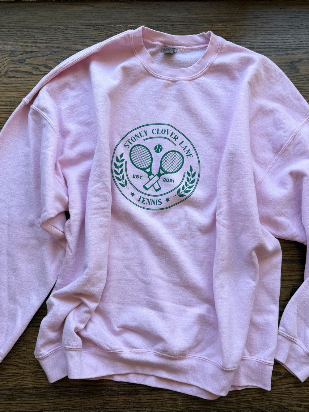 Stoney Clover Lane Pink Crewneck with Green Tennis Emblem
Size 3x